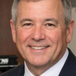 Claude Edward Elkins Jr: From Brakeman to Top Executive