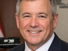 Claude Edward Elkins Jr: From Brakeman to Top Executive