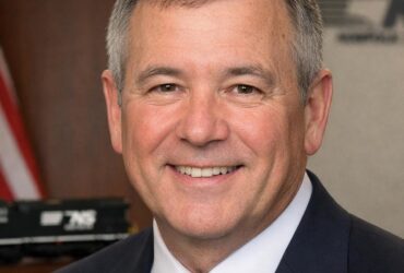 Claude Edward Elkins Jr: From Brakeman to Top Executive