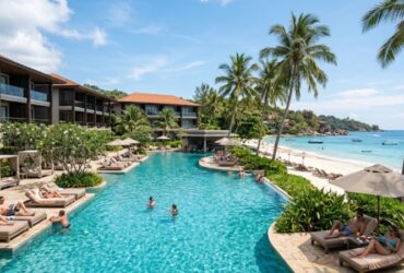 Couple planning cheap holidays at a modern hotel